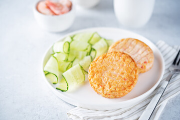 Shrimp patties with cucumber in a plate