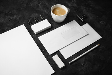 Photo of blank stationery set on black plaster background. Corporate identity template. Responsive design mockup.