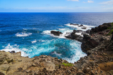 Fototapeta na wymiar Rugged landscape on the side of the Olivine tide pools in the Pacific Ocean along the Kahekili Highway in West Maui, Hawaii, United States