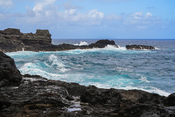 Fototapeta na wymiar Waves crashing near the Olivine tide pools in the Pacific Ocean along the Kahekili Highway in West Maui, Hawaii, United States