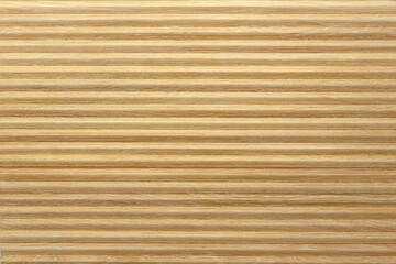 Wavy ceramic tiles with natural wood effect.