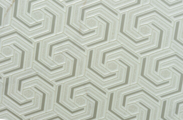 Fototapeta na wymiar Light yellow ceramic tile with a three-dimensional pattern.