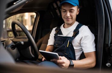 A courier driver of a courier company in uniform delivering groceries to your home