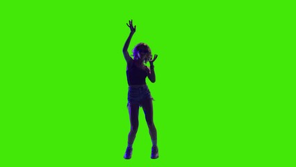 A girl with beautiful silky hair dancing and enjoying in a concert on greenscreen