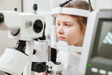 examination of girl with slit lamp. equipping ophthalmologist's office.