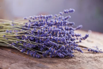 Bunch of lavender flowers on an old wood table © kaprizka