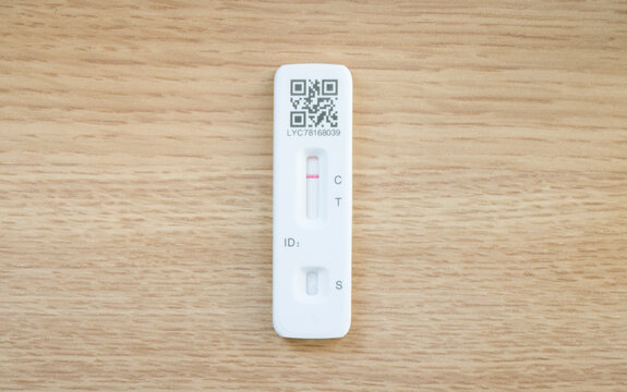 Flat Lay Of Covid LFT Test On Wooden Desk With Copy Space, UK