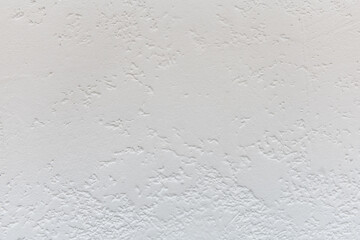 Uniform rough texture of gray plaster. Rough surface coating, decorative wall decoration. Design and interior decoration of residential premises. Texture or background for design
