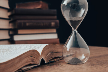 hourglass with book
