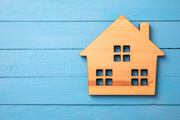 wooden house model on table