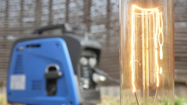 The incandescent light comes on when a person starts a gasoline generator