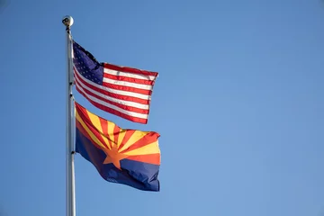 Fotobehang American and Arizona Flag waving at sunset © Seth