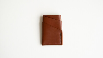 Empty men's business handmade leather card holder with isolated on white background. Selective focus, copy space, close up.