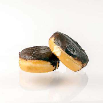 Boston Creme Donuts On A White Background Close Up Photograph With Copy Space