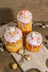 Traditional Easter cake. Festive sweet food with icing and decor. Eggs, nest, willow