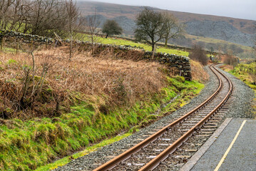 Fototapeta na wymiar Winding railway track,leading to and from Snowdon Ranger railway station,Snowonia National Park,Wales,UK.