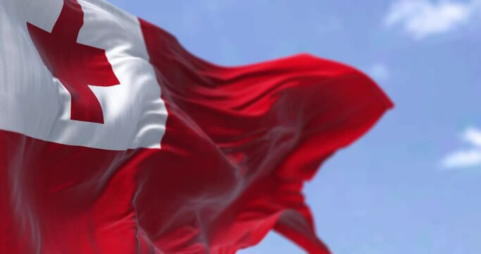 Detail of the national flag of Tonga waving in the wind on a clear day