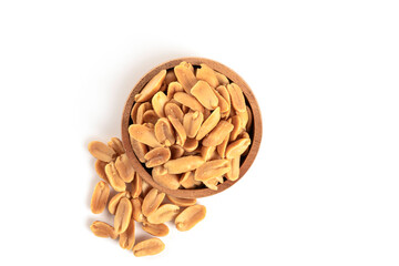 Roasted peanuts in wooden bowl on white background.