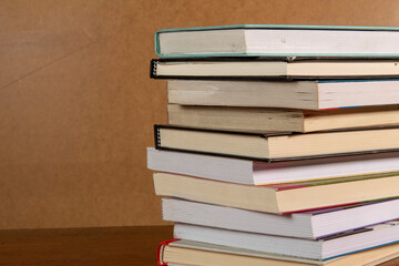 Close-up of background stack of old used books. Pile of vintage old books. Back to school