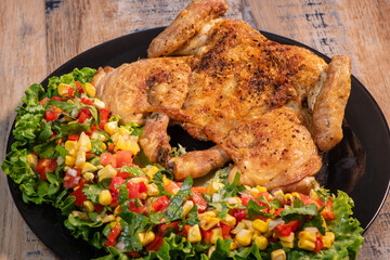 Chicken recipe, roast cockerel and its vegetables, corn condiment