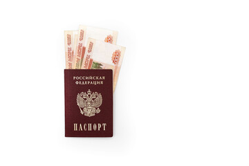 Fototapeta premium Russian passport with banknotes of 5000 rubles on a white background
