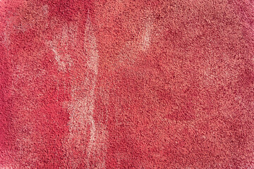 Red cerise old weathered plaster wall, outdoor building texture, Burano Venice