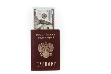 American dollars, 100 dollar bills lie in the passport of the Russian Federation, close-up on a white background