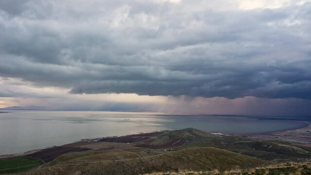 Looking over Utah lake as clouds build and bring heavy rainstorm as it moves through the valley.