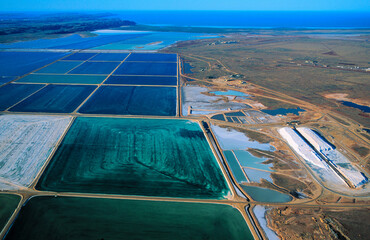 Salt mining at Dampier western Australia, showing the dyed salt ponds to help water evaporate.