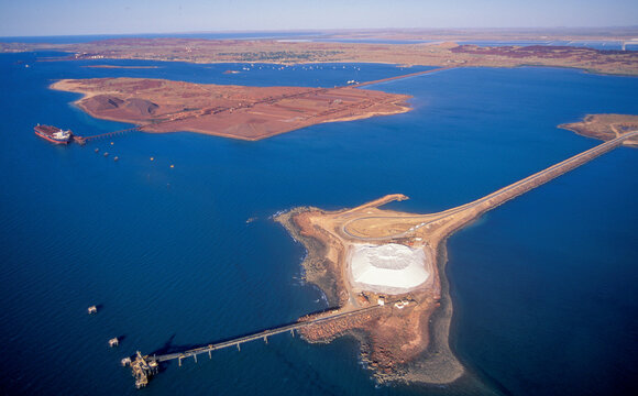 Salt Stock Pile And Iron Ore Stock Pile  At Dampier On The Western Australia Coast.