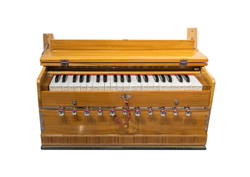 traditional Indian musical organ instrument Harmonium isolated in white background