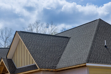 Fototapeta na wymiar Asphalt shingles roofing construction waterproofing for house asphalt shingles corner