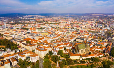 Fototapeta premium Autumn cityscape of Brno with famous gothic Cathedral of Saints Peter and Paul on sunny day, Czech Republic