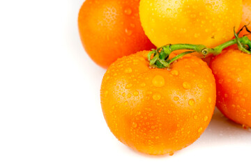 fresh tomatoes Red and yellow with water droplets isolated on white background