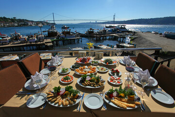 Turkish sea foods and Turkish appetizer foods on the restaurant table at Bosphorus in Istanbul, Turkey.