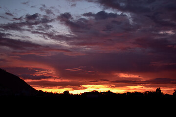 sunset and colorful clouds, sky and clouds in shades of purple, red, lilac, aquamarine.