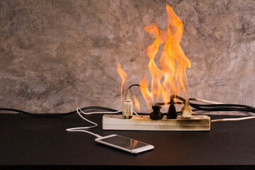 Short circuit An electrical outlet or electronic device bursts into flames while charging a mobile...