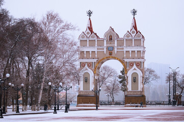 Triumphal Arch on the Victory Square in World War II. Winter morning after snowfall. Trees and...