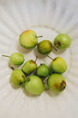 whole green heirloom apples on white background