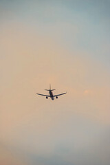 Air transportation system used to transport people and goods by air. Fresh blue sky, colorful sky wide airplane, pink and pastel color of sky, sunlight and sunset view.