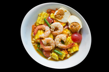 Spicy Corn and Salted Egg Salad on black isolated.