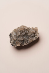 Crystal stone on pink background with copy space