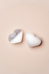 Heart shaped crystal stone on pink background