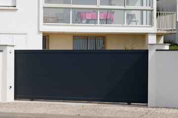 Aluminum door steel dark gray metal gate of house street black portal of suburb access home