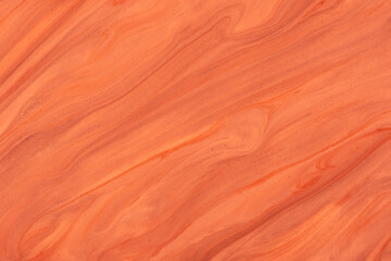 Abstract fluid art background dark orange and red colors. Liquid marble. Acrylic painting on canvas with coral gradient