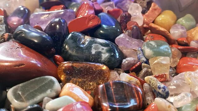Colourful collection of tumbled glossy polished crystal gemstone agate