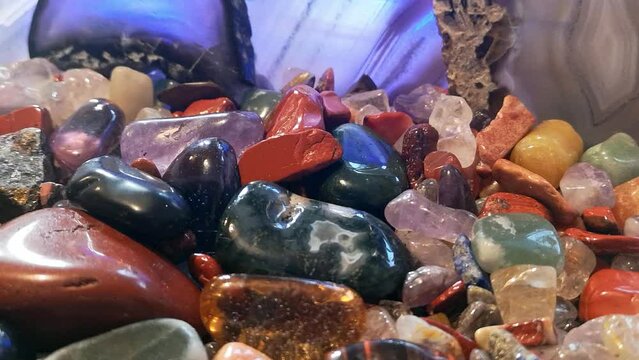 Assortment of colourful tumbled shiny polished crystal gemstone agate
