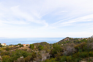 Fototapeta premium View over Colle d' orano village on Elba island in Italy and the sea in the morning