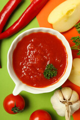 Concept of spicy sauce with Adjika, top view