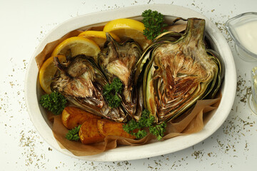 Concept of tasty food with grilled artichoke, top view
